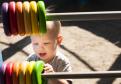 Adorable boy  playing Colorful Abacus