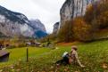 Young girl in lauterbrunnen in Switzerland with a magnificent panoramic view of Swiss alps