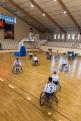 disabled people doing exercise before playing game of wheelchair basketball