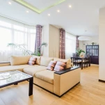 The interior of a beautiful living room with modern furniture in bright colors