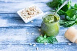 pesto sauce with raw ingredients. Basil pesto sauce