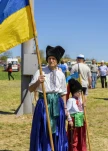 Kherson, Republicanets village, National park Kam'janska Sich , UKRAINE - APRIL 30, 2018: elderly man and little boy in Ukrainian Cossack clothes